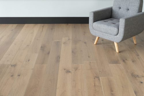 hardwood floor with gray chair