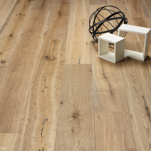 hardwood floor with two white holloe boxes and a black metal sphere