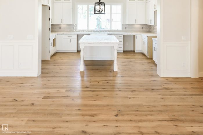 hardwood floors in white kitchen with kitchen island