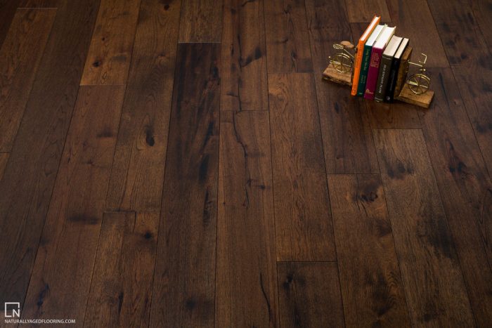 hardwood floor with books between bookends