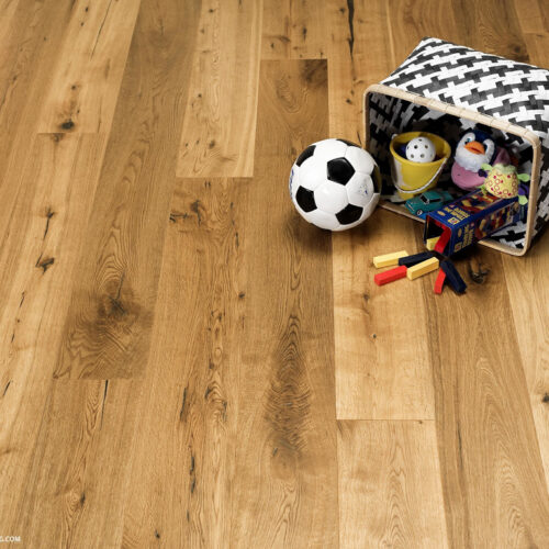 hardwood floor with black and white basket filled with kids toys