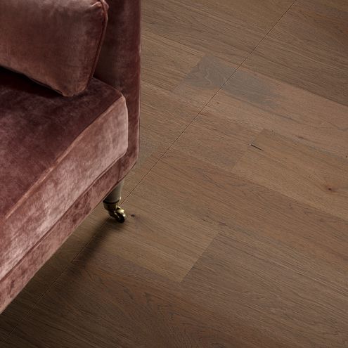 hardwood flooring and corner of a couch