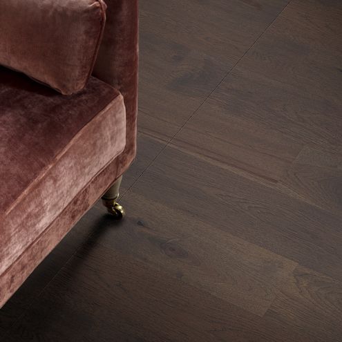 hardwood flooring and corner of a couch