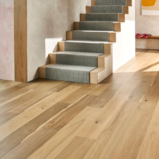 hardwood flooring leading to a staircase