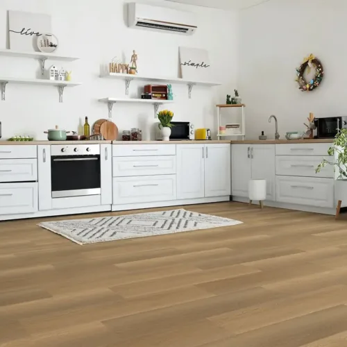Weston warm golden-tan waterproof luxury vinyl plank flooring in a sleek modern kitchen with white cabinets
